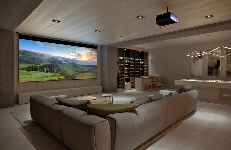 A casual home theater with a sectional, pool table, wine bar, large movie screen, and Sony projector.