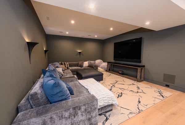 Media room with television, seating and integrated lighting